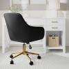 imageMartha Stewart Rayna Swivel Task Chair with Flared Arms for Home Office in Saddle Brown Faux Leather with Oil Rubbed Bronze FrameBlack Faux LeatherPolished Brass Frame