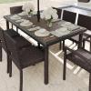imageMartha Stewart Bedford 71quot IndoorOutdoor Patio Table with Faux Wood Top and Rattan Wicker Finish in GrayBrown
